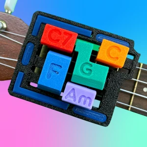 The UkeAssist attached to a Ukulele. 